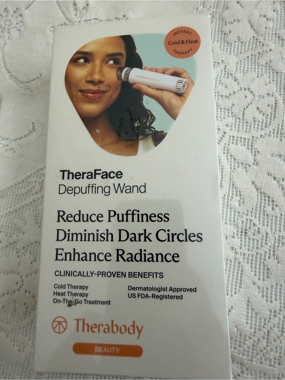 Therabody Theraface Depuffing Wand — White with Orange Accent
